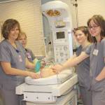Nurses Julie Fritz and Sandy McIntyre show job shadows the high tech nursery at Central Peninsula Hospital.