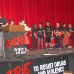 D.A.R.E. grads receive goodie bags and congratulations from community leaders.