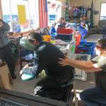 Massage therapist Angie Wellborn massages an attendee at the WOW fundraiser on Saturday, Feb. 24, 2018 near Ninilchik, Alaska. Wellborn donated her tips to the event, and half of any prepaid $60 massage booked at the event. (Photo by Erin Thompson/Peninsula Clarion)