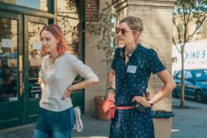 This image released by A24 Films shows director Greta Gerwig, right, and Saoirse Ronan on the set of &ldquo;Lady Bird.&rdquo; (Merie Wallace/A24 via AP)