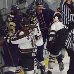 Janesville skater Sean Driscoll (middle) drops the gloves against Kenai River&rsquo;s Alex Klekotka (right) Friday night at the Soldotna Regional Sports Complex. (Photo by Joey Klecka/Peninsula Clarion)
