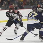 Kenai River skater Michael Spethmann looks for a way around Janesville defenseman Matthew Doyle Friday night at the Soldotna Regional Sports Complex. (Photo by Joey Klecka/Peninsula Clarion)