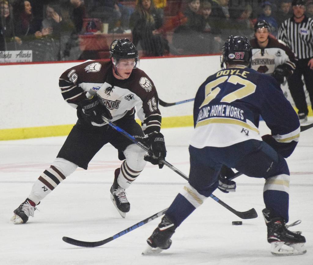 Kenai River skater Michael Spethmann looks for a way around Janesville defenseman Matthew Doyle Friday night at the Soldotna Regional Sports Complex. (Photo by Joey Klecka/Peninsula Clarion)