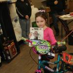 Alice Voight caught a fish and won a bike in the Ice Fishing Derby.