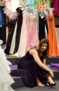 Nikiski High School junior Diana Narimanidze gives a look of approval Friday at Soldotna Prep School while trying on shoes to match a dress she found at Cinderella&rsquo;s Closet, a program that provides free prom dresses and accessories to girls throughout the school district. (Photo by Kat Sorensen/Peninsula Clarion)
