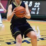 Ninilchik&rsquo;s Isabella Koch drives the lane Wednesday in an opening round contest against Selawik&rsquo;s Davis Ramoth school at the Class 1A state basketball tournament at the Alaska Airlines Center in Anchorage. (Photo by Joey Klecka/Peninsula Clarion)