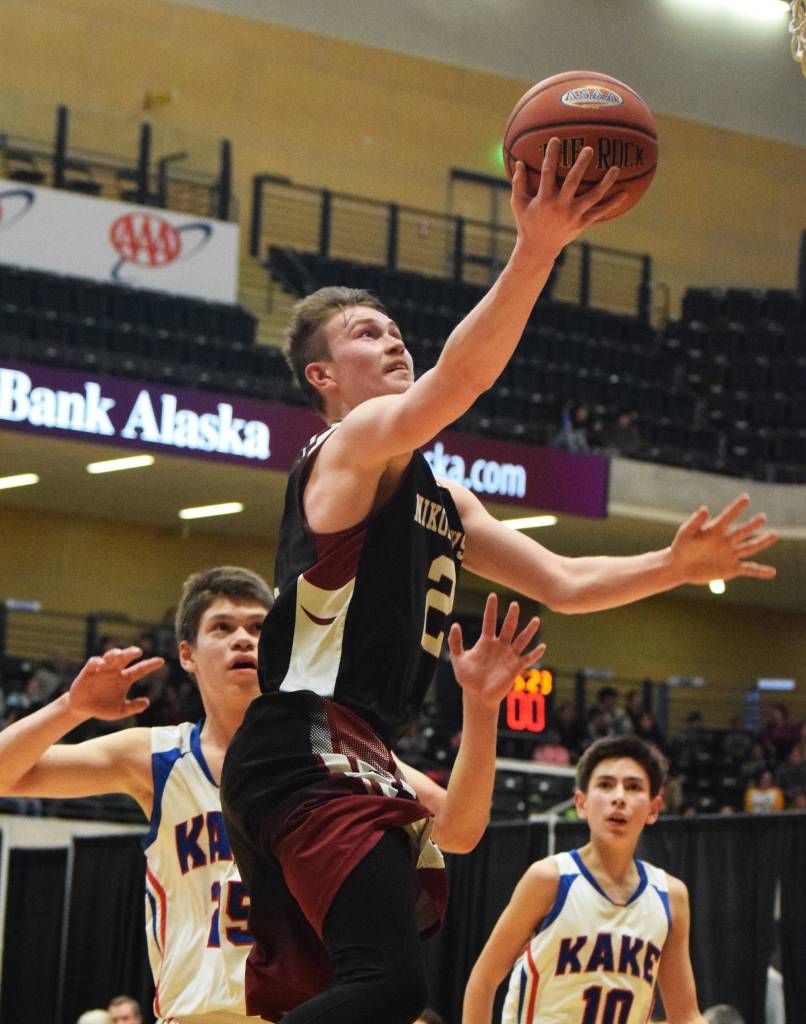 Nikolaevsk&rsquo;s Kalenik Molodih lays in a bucket over the Kake Thunderbirds Wednesday at the Class 1A boys state tournament at the Alaska Airlines Center in Anchorage. (Photo by Joey Klecka/Peninsula Clarion)