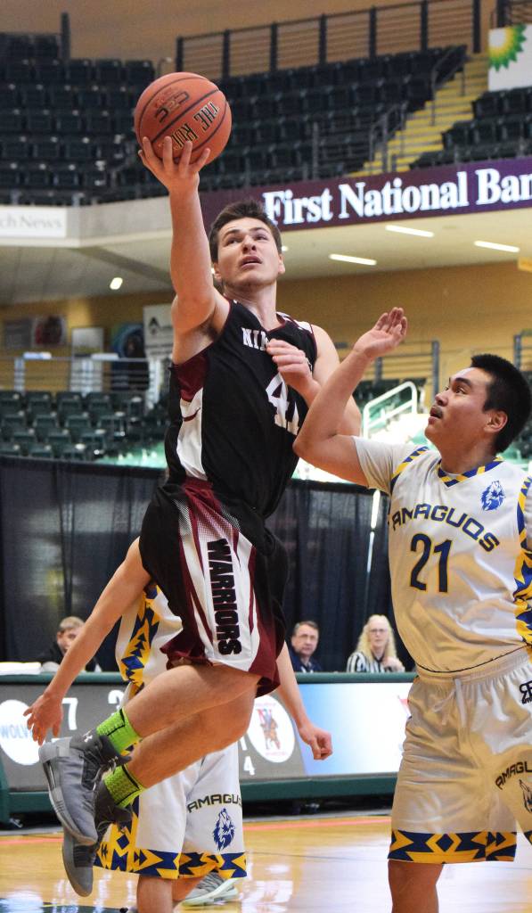 Nikolaevsk&rsquo;s Michael Trail lays in a bucket Thursday in a Class 1A state tournament quarterfinal against Nunamiut at the Alaska Airlines Center in Anchorage. (Photo by Joey Klecka/Peninsula Clarion)