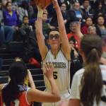 Ninilchik&rsquo;s Olivia Delgado looks for an open teammate Friday in a Class 1A state tournament consolation game against Toksook Bay at the Alaska Airlines Center in Anchorage. (Photo by Joey Klecka/Peninsula Clarion)
