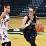 Ninilchik senior Olivia Delgado dribbles by Kake&rsquo;s Willow Jackson (left) Saturday in the Class 1A girls state tournament fourth-place game at the Alaska Airlines Center in Anchorage. (Photo by Joey Klecka/Peninsula Clarion)