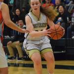 Ninilchik&rsquo;s Isabella Koch dribbles past the top of the key Friday in a Class 1A state tournament consolation game against Toksook Bay at the Alaska Airlines Center in Anchorage. (Photo by Joey Klecka/Peninsula Clarion)