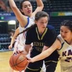 Ninilchik&rsquo;s DeeAnn White battles for a rebound against Kake&rsquo;s Felicia Ross-Shaquanie Saturday in the Class 1A girls state tournament fourth-place game at the Alaska Airlines Center in Anchorage. (Photo by Joey Klecka/Peninsula Clarion)