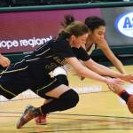 Ninilchik&rsquo;s DeeAnn White dives for a loose ball with Kake&rsquo;s Willow Jackson on Saturday in the Class 1A girls state tournament fourth-place game at the Alaska Airlines Center in Anchorage. (Photo by Joey Klecka/Peninsula Clarion)