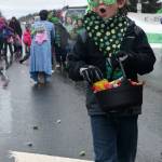 TOP LEFT: Kenneth Fine of Soldotna marches in the St. Patrick&rsquo;s Day Parade along the Kenai Spur Highway on Saturday.