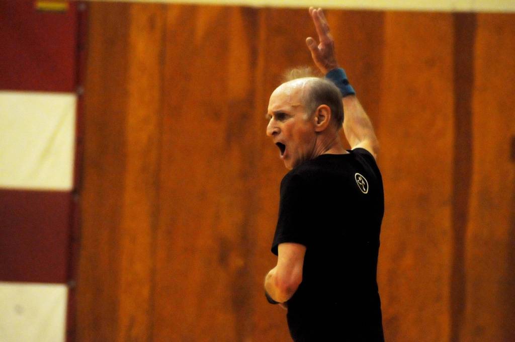 Zumba instructor Truman Krogel leads a class at the Kenai Recreation Center on Thursday, March 15, 2018 in Kenai, Alaska. Krogel, 74, said he first tried Zumba himself four years ago, loved it and began teaching classes of his own in January 2017. (Photo by Elizabeth Earl/Peninsula Clarion)