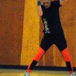 Zumba instructor Truman Krogel leads a class at the Kenai Recreation Center on Thursday, March 15, 2018 in Kenai, Alaska. Krogel, 74, said he first tried Zumba himself four years ago, loved it and began teaching classes of his own in January 2017. (Photo by Elizabeth Earl/Peninsula Clarion)