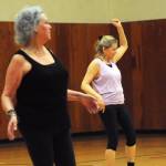 Sallie Macy (right) and Glenna Hudson (left), students in Truman Krogel&rsquo;s Zumba Gold class, follow the steps to a song during a class at the Kenai Recreation Center on Thursday, March 15, 2018 in Kenai, Alaska. Krogel, 74, said he first tried Zumba himself four years ago, loved it and began teaching classes of his own in January 2017. (Photo by Elizabeth Earl/Peninsula Clarion)