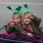 Twin lassies wave along the way of Soldotna&rsquo;s St. Patrick&rsquo;s Day parade.