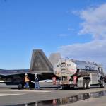 A Crowley tanker truck fuels the eight U.S. Air Force F-22 &ldquo;Raptor&rdquo; fighter jets that landed at the Kenai Municipal Airport on Monday, March 19, 2018 in Kenai. Weather conditions stopped the fighters from landing at Joint Base Elmendorf-Richardson in Anchorage, their home field. Four of the F-22s belong to the 90th Fighter Squadron and four to the 525th Fighter Squadron, which were on separate training flights before landing in Kenai, said Major Stephen Montgomery, a pilot with the 90th. The fighters took off for Anchorage Monday afternoon. F-22s from Elmendorf have been occasionally using Kenai as an alternate landing site since October 2016, when a pair of the fighters landed there to assess the possibility. (Photo by Ben Boettger/Peninsula Clarion)