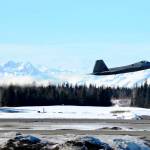 As a U.S. Air Force F-22 &ldquo;Raptor&rdquo; fighter jet takes off from the Kenai Municipal Airport, others await fueling on Monday, March 19, 2018 in Kenai. Eight of the fighters landed at the Kenai airport Monday after weather conditions kept them from Joint Base Elmendorf-Richardson in Anchorage, their home field. Four of the F-22s belong to the 90th Fighter Squadron and four to the 525th Fighter Squadron, which were on separate training flights before landing in Kenai, said Major Stephen Montgomery, a pilot with the 90th. The fighters took off for Anchorage Monday afternoon. F-22s from Elmendorf have been occasionally using Kenai as an alternate landing site since October 2016, when a pair of the fighters landed there to assess the possibility. (Photo by Ben Boettger/Peninsula Clarion)