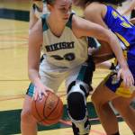 Nikiski&rsquo;s Bethany Carstens makes a move around Kotzebue&rsquo;s Alanna Conwell Friday at the Class 3A state tournament at the Alaska Airlines Center. (Photo by Joey Klecka/Peninsula Clarion)