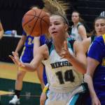 Nikiski&rsquo;s Kaitlyn Johnson grabs a rebound Friday against Kotzebue at the Class 3A state tournament at the Alaska Airlines Center. (Photo by Joey Klecka/Peninsula Clarion)