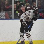 Kenai River skater Sutton McDonald looks for an open shot Friday night against the Fairbanks Ice Dogs at the MTA Events Center in Palmer. (Photo by Joey Klecka/Peninsula Clarion)