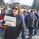 A participant in the Alaskans Choose Respect Awareness Event promotes the &ldquo;choose respect&rdquo; message during a march to the Kenai Visitor and Cultural Center in Kenai on March 28. Hosted by the LeeShore Center, the event aimed to bring awareness to the issue of domestic violence and sexual assault. (Photo by Erin Thompson/Peninsula Clarion)