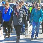 Marchers make their way along Frontage Road to the Kenai Visitor and Cultural Center as part of the Alaskans Choose Respect Awareness Event, hosted by the LeeShore Center on March 28. The event aimed to bring awareness to the issue of domestic violence and sexual assault. (Photo by Erin Thompson/Peninsula Clarion)