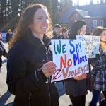 A woman protests against violence during the Alaskans Choose Respect Awareness Event, hosted by the LeeShore Center, on Wednesday, March 28 in Kenai. The march aimed to draw attention to the issue of sexual assault and domestic violence. (Photo by Erin Thompson/Peninsula Clarion)
