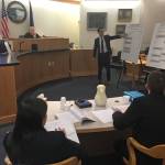 State attorneys Elizabeth Bakalar, foreground left, and Margaret Paton-Walsh, foreground right, listen to arguments made by attorney Jon Choate on Thursday, Sept. 21, 2017 in Alaska Superior Court in Juneau. At background left is Judge Philip Pallenberg, who is expected to decide the Alaska Democratic Party&rsquo;s lawsuit against the state next week. (James Brooks | Juneau Empire File)