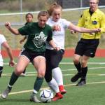 Kenai Central&rsquo;s Liz Hanson (right) battles for possession with a Colony player in a consolation semifinal May 26, 2017, at the girls state soccer tournament at Eagle River High School. (Photo by Joey Klecka/Peninsula Clarion)
