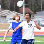 Soldotna&rsquo;s Whitney Wortham heads the ball in front of Kodiak&rsquo;s Cassie Scherler April 22, 2017, at Justin Maile Field in Soldotna (Photo by Joey Klecka/Peninsula Clarion)