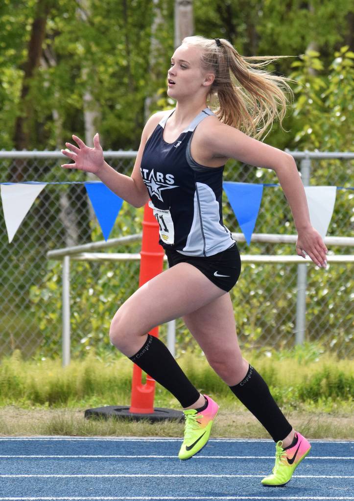 Soldotna&rsquo;s Brittany Taylor rounds a bend in the Class 4A girls 400-meter dash May 27, 2017, at the Alaska state track & field championships at Palmer High School. (Photo by Joey Klecka/Peninsula Clarion)