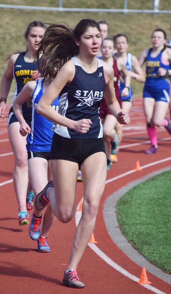 Soldotna senior Kellie Arthur leads a pack of runners in the girls 1,600 meters Saturday afternoon at Homer High School. (Photo by Joey Klecka/Peninsula Clarion)