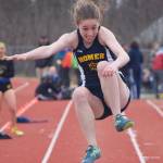 Homer freshman Laura Inama leaps into the sand pit in the girls long jump Saturday afternoon at Homer High School. (Photo by Joey Klecka/Peninsula Clarion)