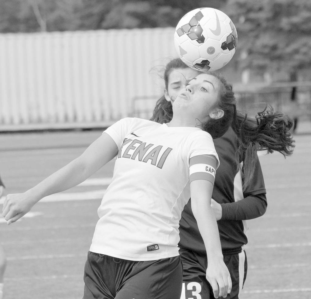 Kenai Central&rsquo;s Brenna Eubank controls the ball in front of Nikiski&rsquo;s Tika Zimmerman on Monday at Kenai Central High School. (Photo by Jeff Helminiak/Peninsula Clarion)