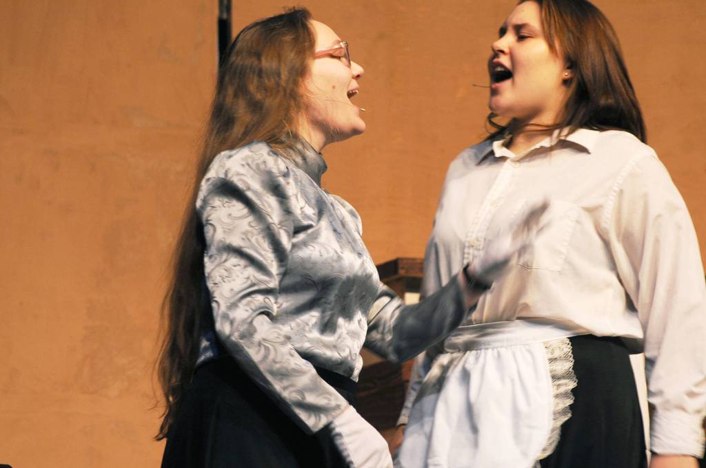 Governess Ms. Andrews (played by Sarah Nash) lectures one of the Banks&rsquo; family&rsquo;s maids (played by Treasa Cooper) during a dress rehearsal for Nikiski Middle-High School&rsquo;s production of &ldquo;Mary Poppins&rdquo; on Monday, April 23, 2018 in Nikiski, Alaska. The play premiers Friday at 7 p.m. at the high school. Tickets are $15. (Photo by Elizabeth Earl/Peninsula Clarion)