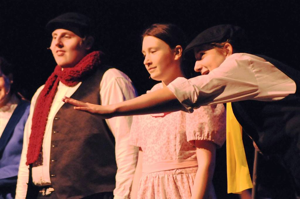 One of the chimneysweeps speaks to Jane Banks (played by Leora McCaughey) during a dress rehearsal for Nikiski Middle-High School&rsquo;s production of &ldquo;Mary Poppins&rdquo; on Monday, April 23, 2018 in Nikiski, Alaska. The play premiers Friday at 7 p.m. at the high school. Tickets are $15. (Photo by Elizabeth Earl/Peninsula Clarion)