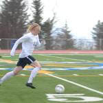 Homer senior Charles Rohr charges down the field with the ball during Homer High School&rsquo;s game against Kenai Central High School on Tuesday, April 24, 2018 in Homer, Alaska. The Kardinals beat the Mariners 6-2. (Photo by Megan Pacer/Homer News)