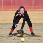 Kenai Central&rsquo;s Zaharah Wilshusen fields a grounder from a Kodiak batter Thursday evening at Steve Shearer Memorial Ball Park in Kenai. (Photo by Joey Klecka/Peninsula Clarion)