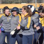 Homer junior Brianna Hetrick (second from left) celebrates with her teammates after touching home plate following a home run Tuesday evening at the Soldotna Little League fields. (Photo by Joey Klecka/Peninsula Clarion)