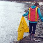 Ryan Crapps hands up trash from a stream near Keystone Drive in Soldotna during the Kenai National Wildlife Refuge&rsquo;s Green Up, Clean Up event on Wednesday, May 2, 2018. Approximately 45 people, including three Girl Scout troops, spent the afternoon cleaning up roadsides along the refuge as part of a week-long effort by refuge staff to rid roadways of trash accumulated during the winter months. (Photo by Erin Thompson/Peninsula Clarion)