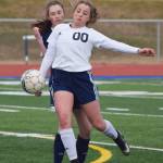 Soldotna&rsquo;s Ryann Cannava (00) blocks the ball from Homer&rsquo;s Andie Sonnen Thursday afternoon in a Peninsula Conference contest at Soldotna High School. (Photo by Joey Klecka/Peninsula Clarion)