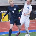 Homer&rsquo;s Charles Rohr (2) brings the ball up the sideline with Soldotna&rsquo;s Ben Snow in hot pursuit Thursday afternoon in a Peninsula Conference contest at Soldotna High School. (Photo by Joey Klecka/Peninsula Clarion)