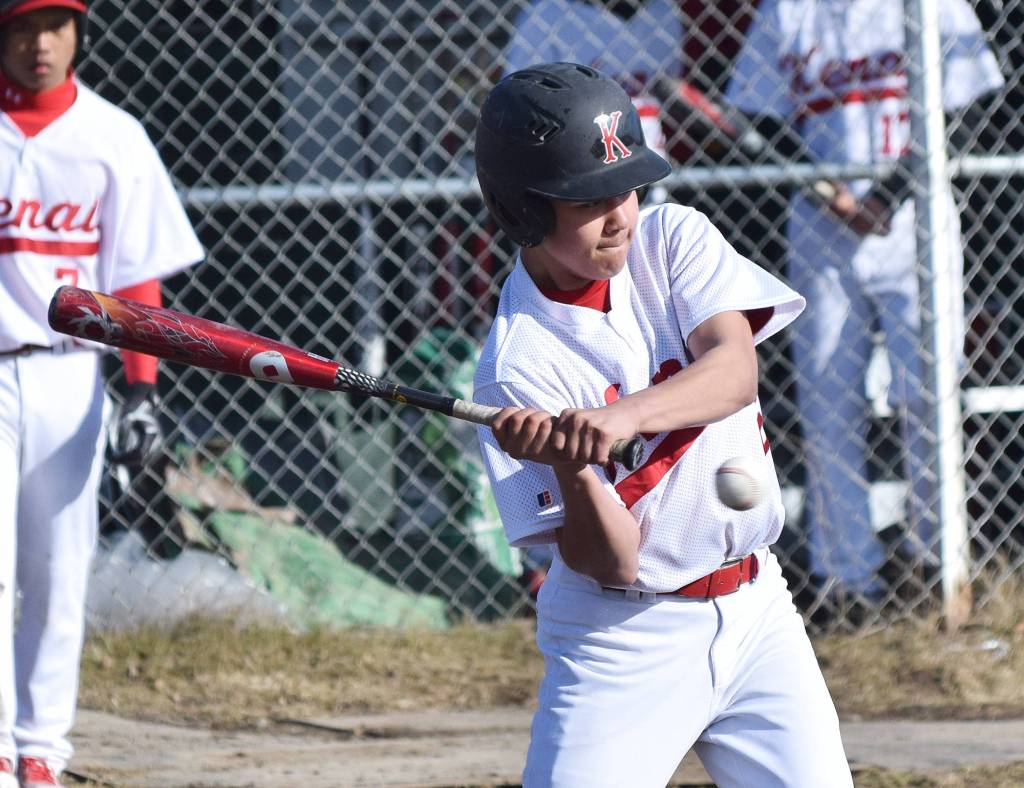 Kenai&rsquo;s Lance Kramer checks his swing on a Kodiak pitch Friday at the Kenai Little League Fields. (Photo by Joey Klecka/Peninsula Clarion)