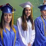 From left, Breona Michele DeLon, Chanelle Frances Usvat and Gabriel Nicholas Bignell prepare for their graduation at Cook Inlet Academy on Sunday, May 6. (Photo by Erin Thompson/Peninsula Clarion)