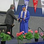 Gabriel Nicholas Bignell accepts his diploma from Cook Inlet Academy in Soldotna, Alaska, on Sunday, May 6. Bignell, who graduates magna cum laude, will attend University of Alaska Fairbanks in the fall and work to earn a degree in mechanical engineering. (Photo by Erin Thompson/Peninsula Clarion)