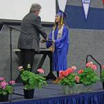 Breona Michele DeLon accepts her diploma from Cook Inlet Academy in Soldotna, Alaska, on Sunday, May 6. DeLon, who graduated magna cum laude, received a full-ride scholarship from the Naval Reserve Officers Training Corps to attend Point Loma Nazarene University in San Diego, where she will study social work with an emphasis on sociology. (Photo by Erin Thompson/Peninsula Clarion)