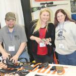 Kelly Martin, KPAR CEO, checks out the Wall of Guns.